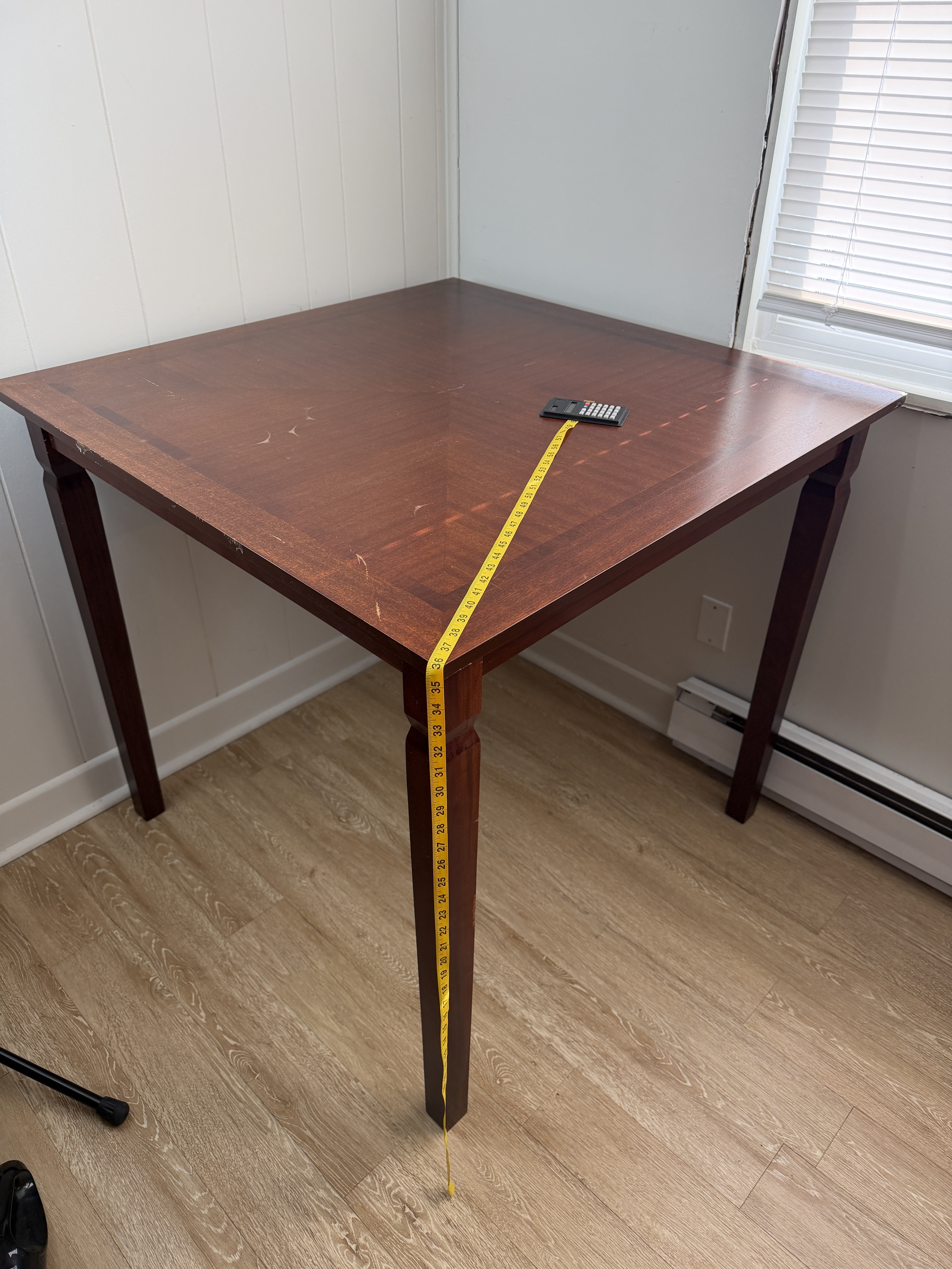 Dark composite wood square table with 2 tall chairs