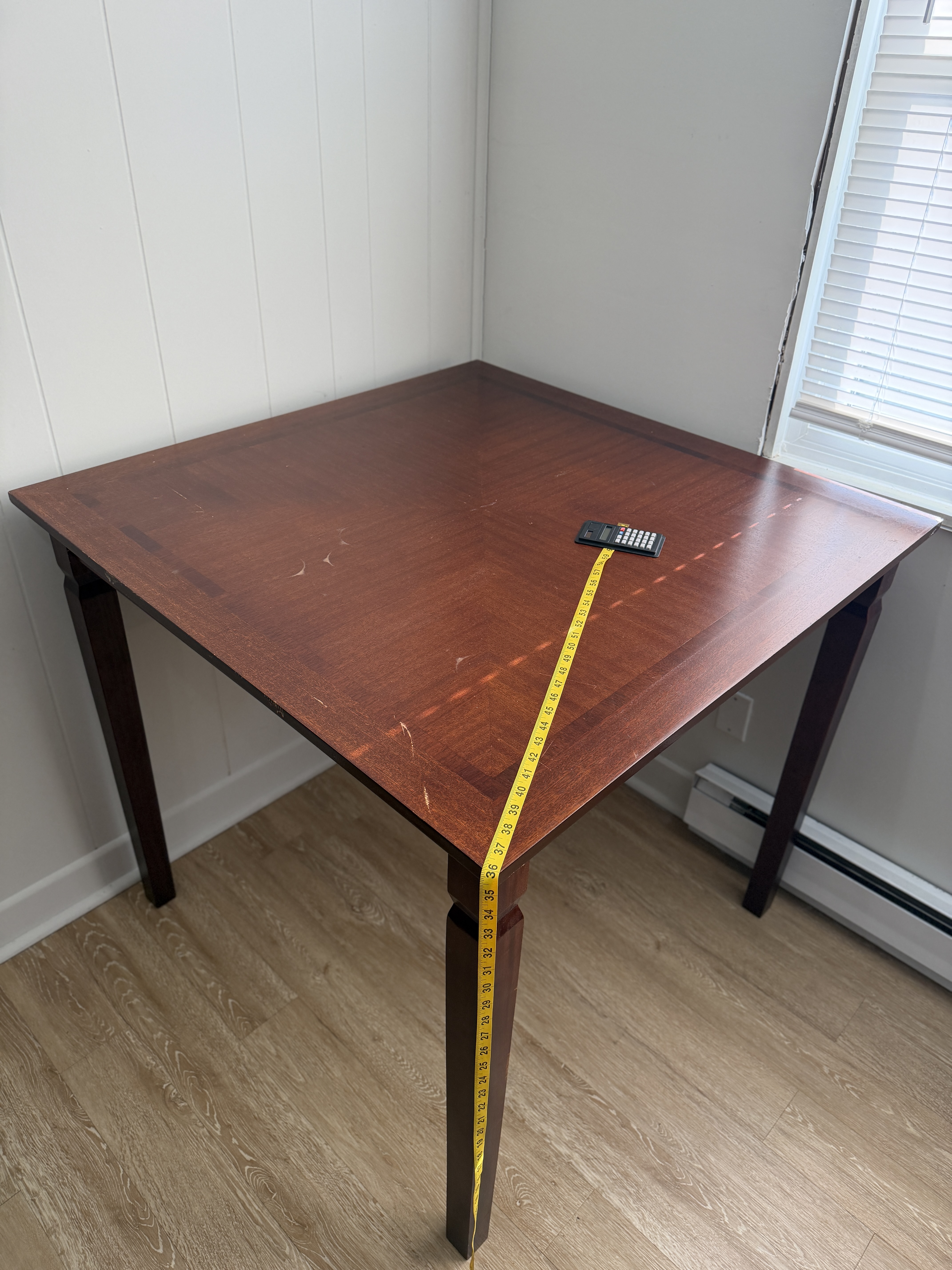 Dark composite wood square table with 2 tall chairs
