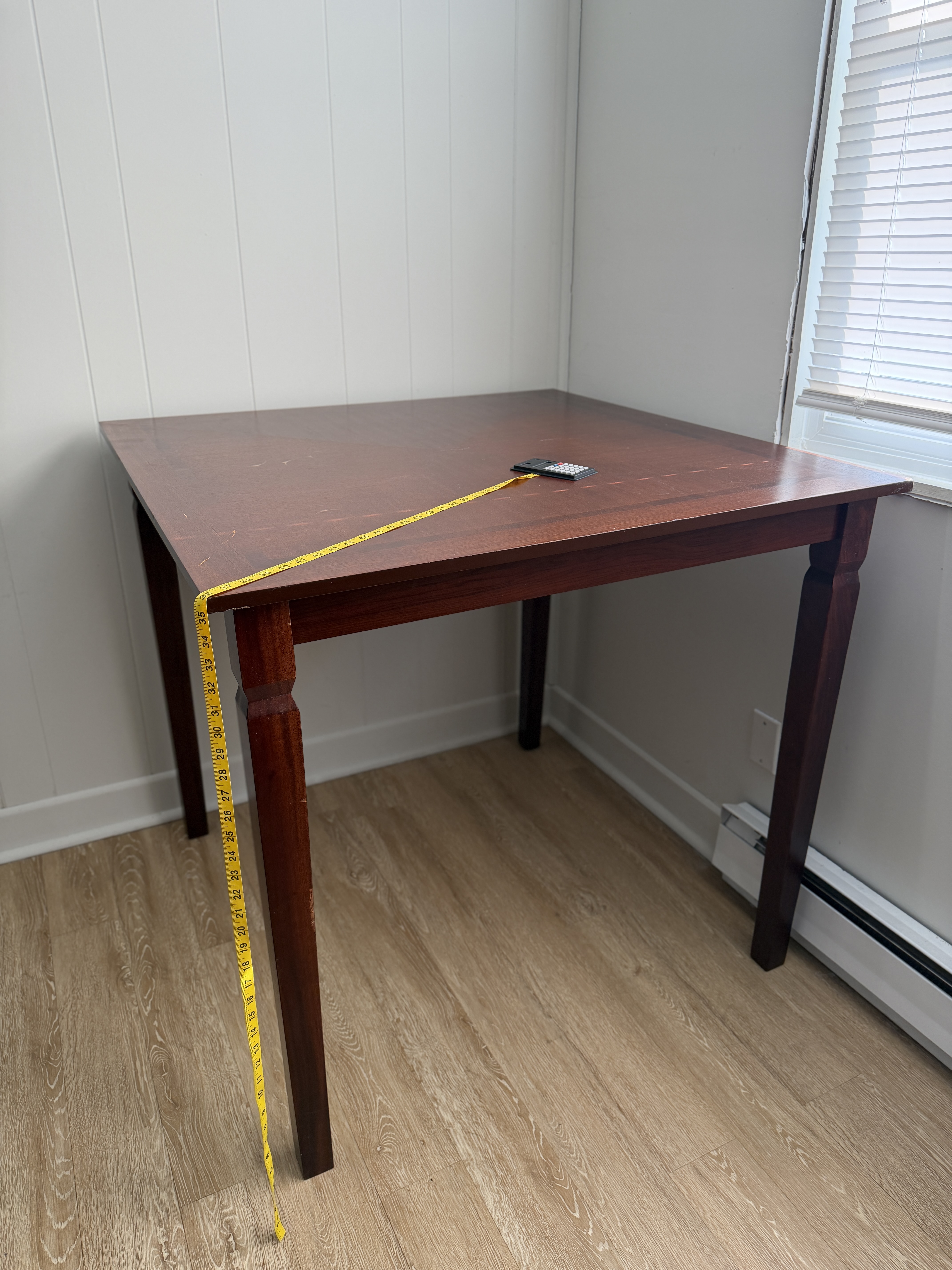 Dark composite wood square table with 2 tall chairs