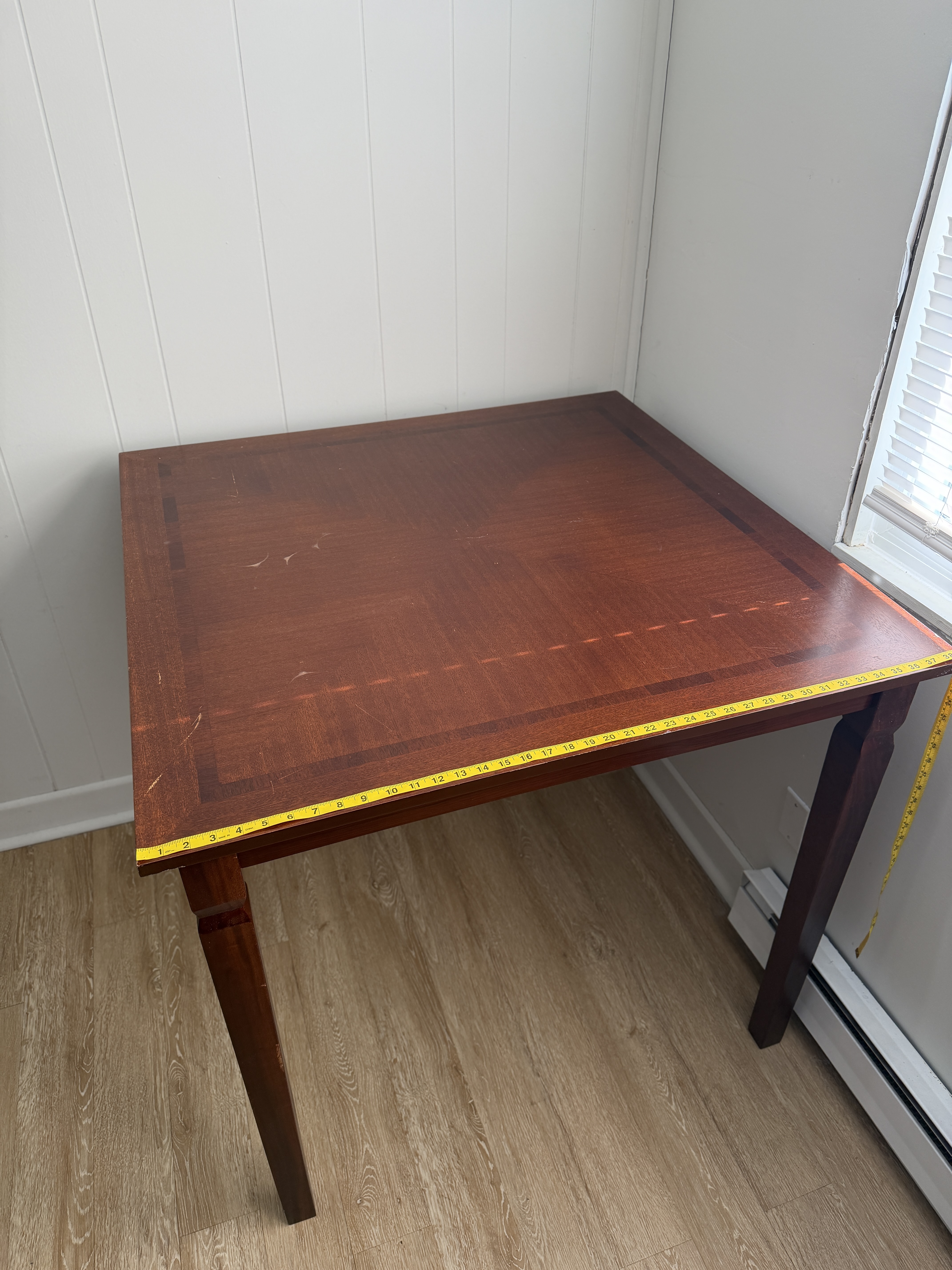 Dark composite wood square table with 2 tall chairs