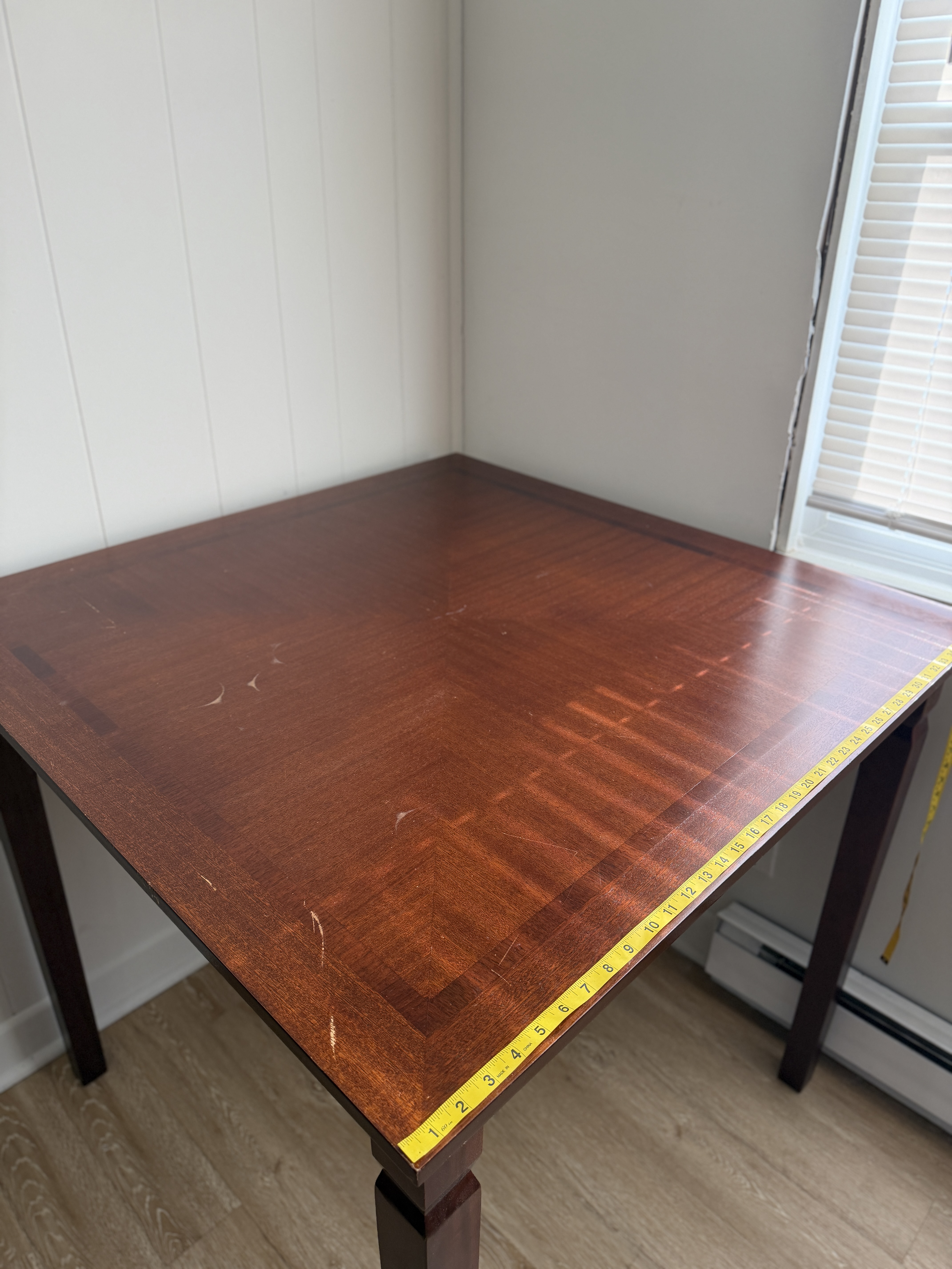 Dark composite wood square table with 2 tall chairs